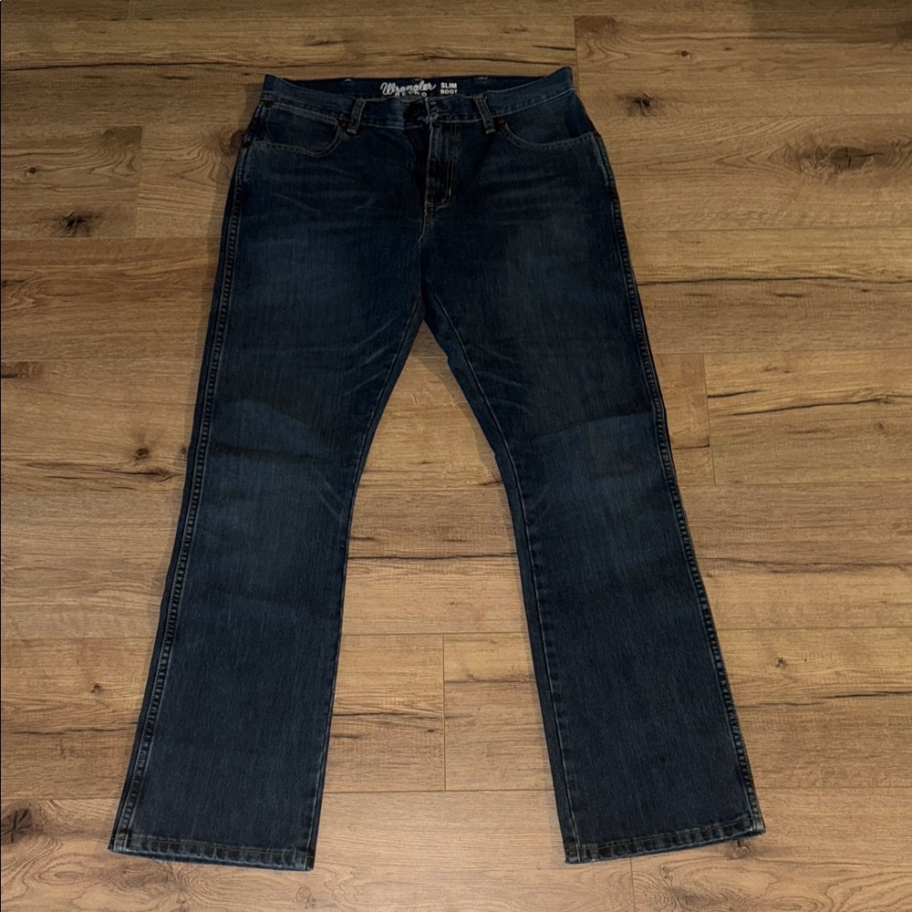 Wrangler Men's Deep Indigo retro bootcut jeans. 34x34
